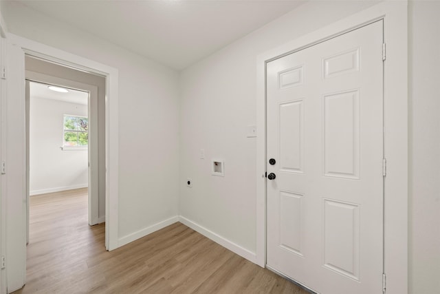 1012 W Trinity St, Groesbeck, TX 76642 - laundry room with electric dryer hookup, washer hookup, and light wood-type flooring