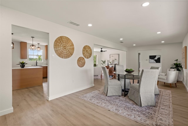 1012 W Trinity St, Groesbeck, TX 76642 - dining area featuring light wood-style flooring and recessed lighting