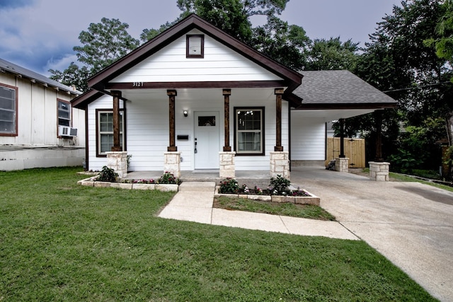 3127 Mcdermott Ave, Dallas, TX 75215 - view of front of home featuring driveway, an attached carport, a shingled roof, covered porch, and cooling unit