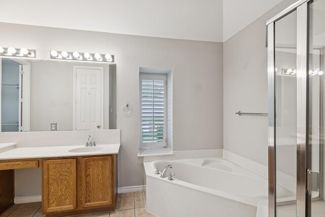 4471 Chandler Dr, Frisco, TX 75034 - bathroom with vanity, a bath, tile patterned floors, and a shower stall