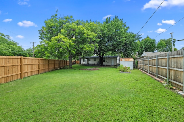 3000 Binyon St, Fort Worth, TX 76133 - fenced backyard featuring a storage unit