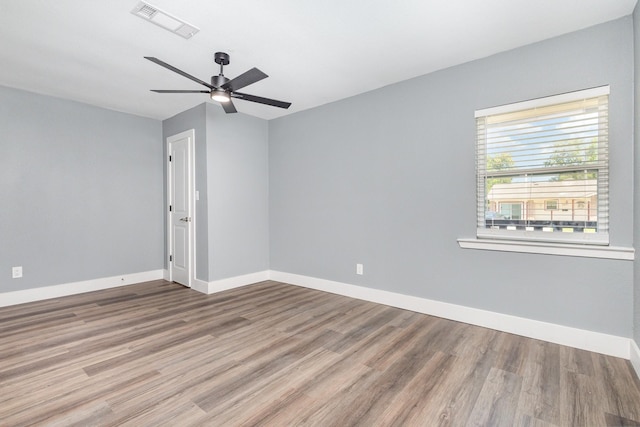 3828 Pacesetter Dr, Dallas, TX 75241 - spare room with wood finished floors and ceiling fan