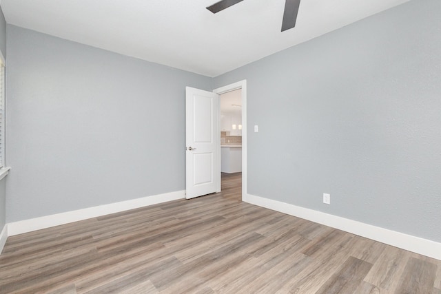 3828 Pacesetter Dr, Dallas, TX 75241 - unfurnished room featuring wood finished floors and a ceiling fan