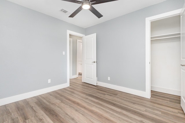 3828 Pacesetter Dr, Dallas, TX 75241 - unfurnished bedroom with light wood-style floors, a closet, and ceiling fan