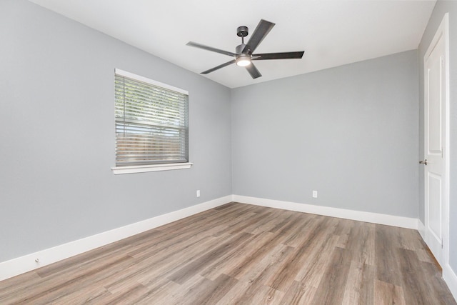 3828 Pacesetter Dr, Dallas, TX 75241 - empty room with wood finished floors and ceiling fan