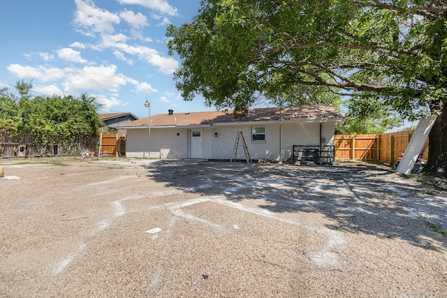3828 Pacesetter Dr, Dallas, TX 75241 - back of house featuring brick siding