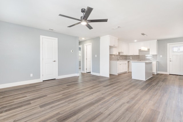3828 Pacesetter Dr, Dallas, TX 75241 - unfurnished living room featuring light wood-style floors, ceiling fan, and recessed lighting