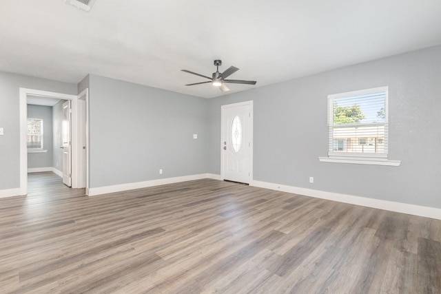 3828 Pacesetter Dr, Dallas, TX 75241 - unfurnished living room with a ceiling fan and wood finished floors