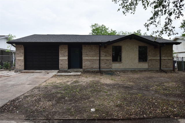 4918 Stagecoach Ln, Garland, TX 75043 - ranch-style home with brick siding, a garage, and concrete driveway