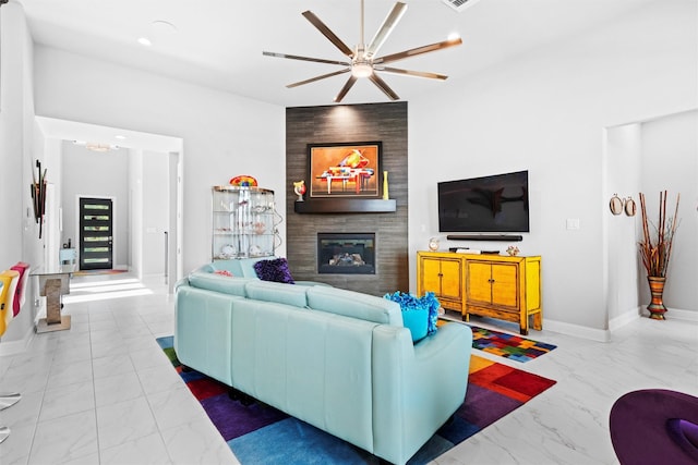 1833 Rolling Heights Ln, Fort Worth, TX 76008 - living room with marble look tile flooring, a fireplace, ceiling fan, and recessed lighting