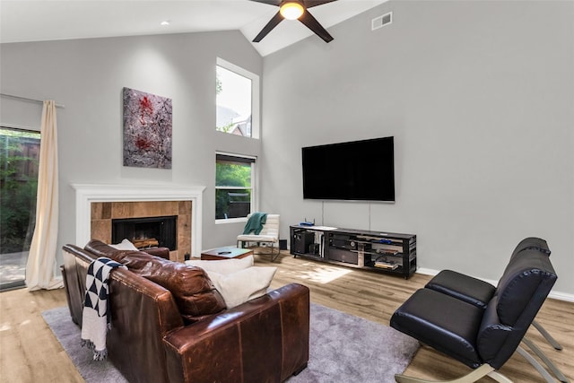 14902 Le Grande Dr, Addison, TX 75001 - living area featuring light wood-style flooring, a ceiling fan, plenty of natural light, and high vaulted ceiling