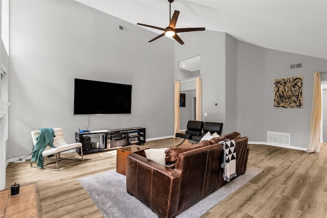 14902 Le Grande Dr, Addison, TX 75001 - living area with high vaulted ceiling, ceiling fan, and wood finished floors
