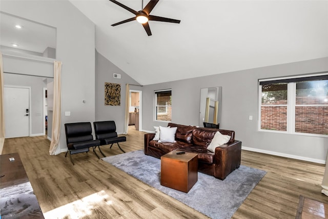 14902 Le Grande Dr, Addison, TX 75001 - living area with high vaulted ceiling, ceiling fan, wood finished floors, and recessed lighting