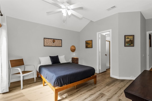 14902 Le Grande Dr, Addison, TX 75001 - bedroom with light wood-style flooring, lofted ceiling, and a ceiling fan