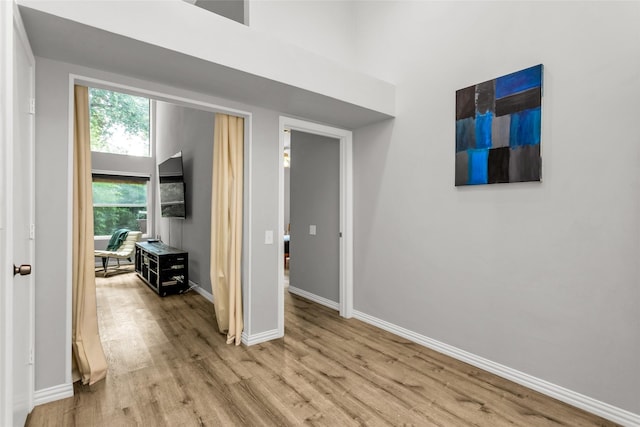 14902 Le Grande Dr, Addison, TX 75001 - hallway with wood finished floors and baseboards