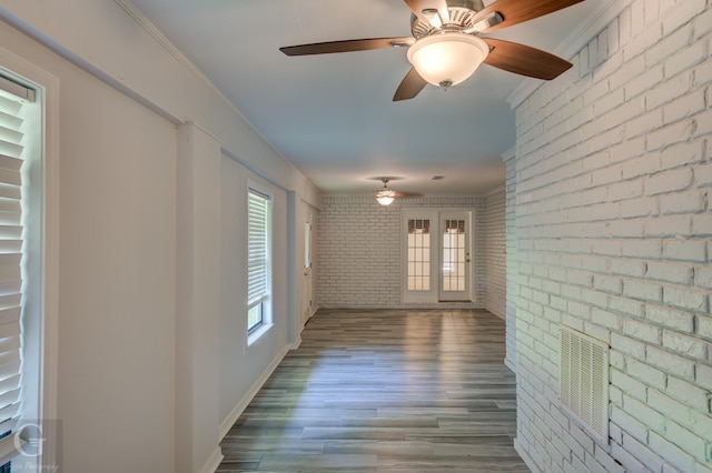163 Sistrunk Ln, Bossier City, LA 71112 - corridor with brick wall, wood finished floors, and ornamental molding