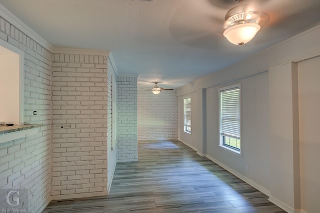 163 Sistrunk Ln, Bossier City, LA 71112 - corridor with brick wall, wood finished floors, and ornamental molding