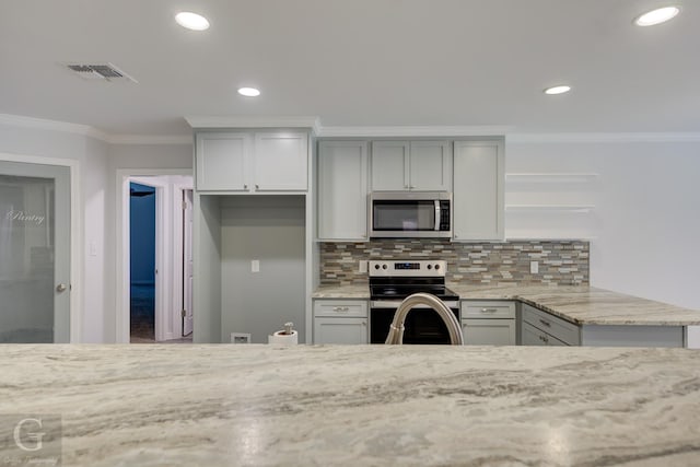 163 Sistrunk Ln, Bossier City, LA 71112 - kitchen with appliances with stainless steel finishes, ornamental molding, open shelves, light stone countertops, and recessed lighting