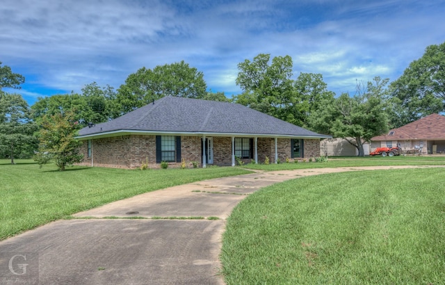 163 Sistrunk Ln, Bossier City, LA 71112 - single story home featuring a front yard, brick siding, and a shingled roof