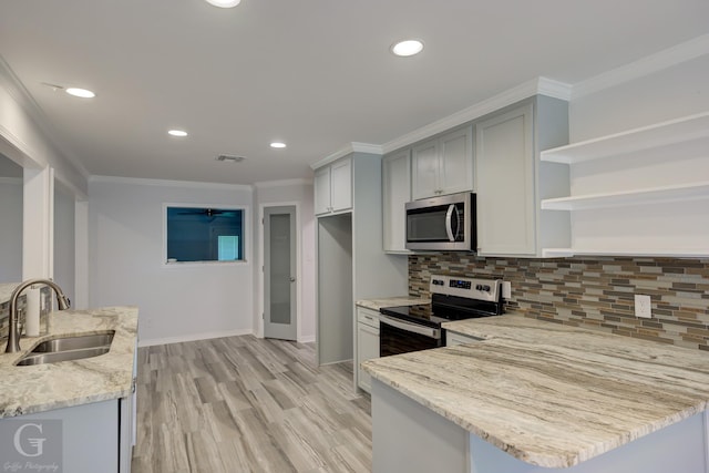 163 Sistrunk Ln, Bossier City, LA 71112 - kitchen with stainless steel appliances, a peninsula, light stone counters, open shelves, and crown molding