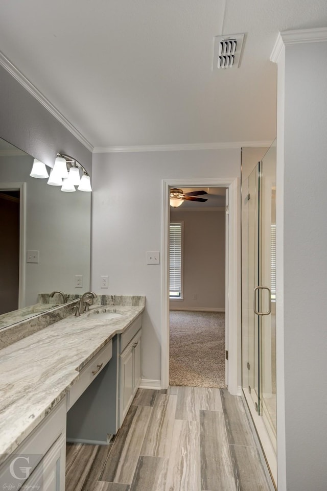 163 Sistrunk Ln, Bossier City, LA 71112 - full bath featuring vanity, crown molding, a shower stall, ceiling fan, and wood finished floors