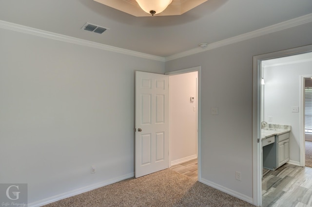 163 Sistrunk Ln, Bossier City, LA 71112 - unfurnished bedroom featuring ornamental molding, ensuite bath, and light colored carpet