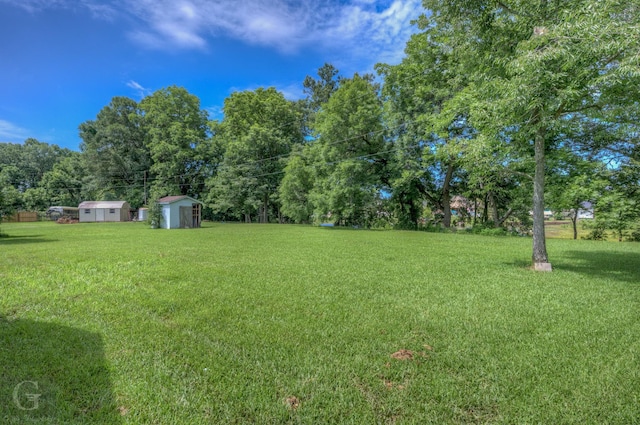 163 Sistrunk Ln, Bossier City, LA 71112 - view of grassy yard featuring a shed