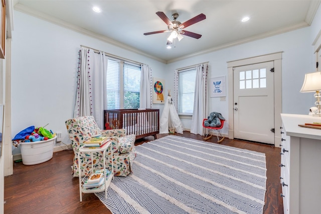5818 Worth St, Dallas, TX 75214 - foyer with crown molding, a ceiling fan, dark wood-style flooring, and recessed lighting