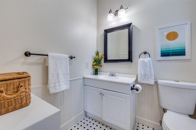 5818 Worth St, Dallas, TX 75214 - bathroom featuring vanity and a wainscoted wall