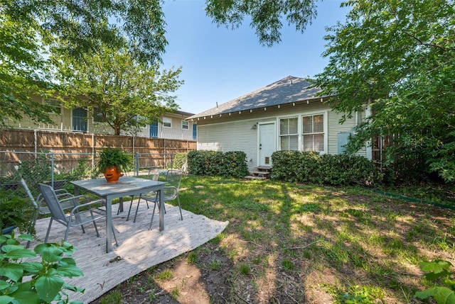 5818 Worth St, Dallas, TX 75214 - view of yard with entry steps and outdoor dining area