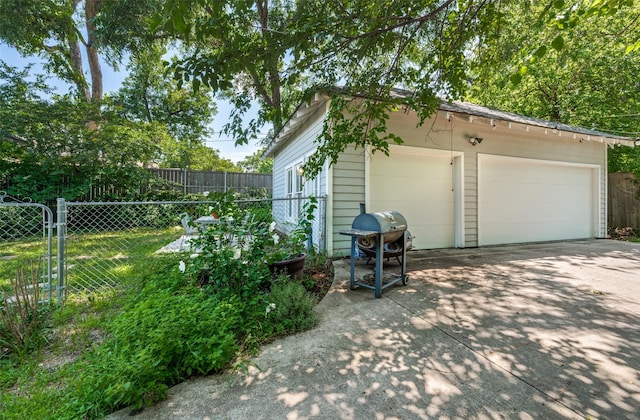 5818 Worth St, Dallas, TX 75214 - view of property exterior featuring an outdoor structure and a garage