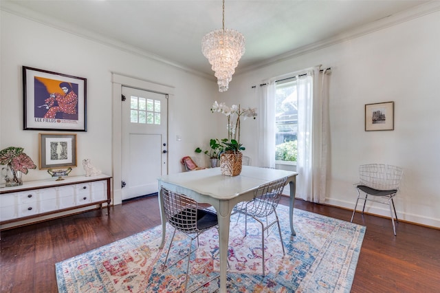 5818 Worth St, Dallas, TX 75214 - dining space featuring a chandelier, crown molding, and dark wood-type flooring