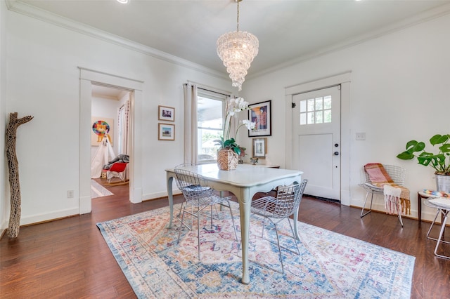 5818 Worth St, Dallas, TX 75214 - dining space featuring a chandelier, crown molding, and dark wood-style floors
