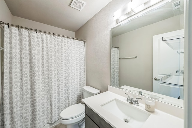 2806 Ocean Dr, Lancaster, TX 75146 - bathroom with vanity, a textured wall, and a shower with curtain
