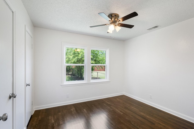 1308 Edgecliff Rd, Fort Worth, TX 76134 - unfurnished bedroom featuring dark wood-type flooring, a textured ceiling, and a ceiling fan