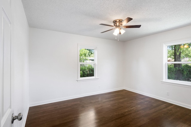 1308 Edgecliff Rd, Fort Worth, TX 76134 - spare room featuring dark wood-style flooring, a textured ceiling, and a ceiling fan