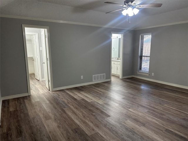 1112 Ranger Ct, Plano, TX 75075 - spare room featuring ornamental molding, ceiling fan, dark wood-style flooring, and a textured ceiling