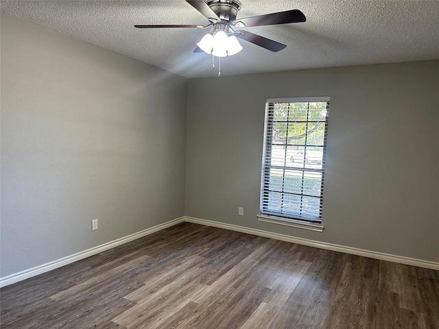 1112 Ranger Ct, Plano, TX 75075 - empty room featuring dark wood-style flooring, a textured ceiling, and a ceiling fan
