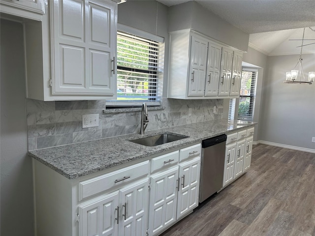 1112 Ranger Ct, Plano, TX 75075 - kitchen with dishwasher, white cabinets, decorative backsplash, healthy amount of natural light, and crown molding