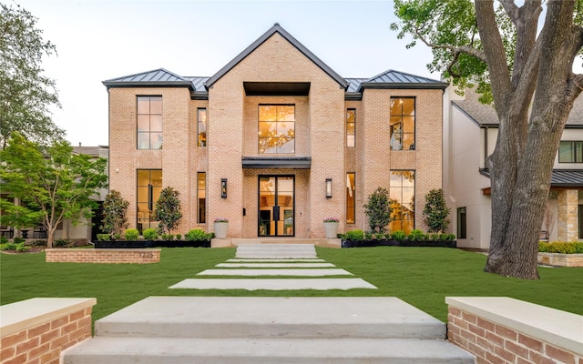 7226 Colgate Ave, Dallas, TX 75225 - view of front of property with a standing seam roof, a metal roof, and a front lawn