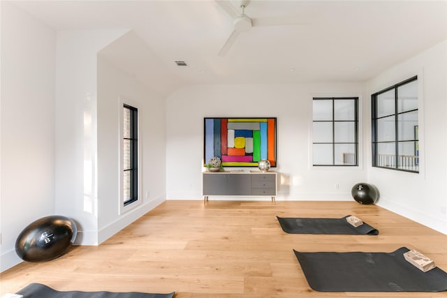 7226 Colgate Ave, Dallas, TX 75225 - workout room featuring a ceiling fan and wood finished floors