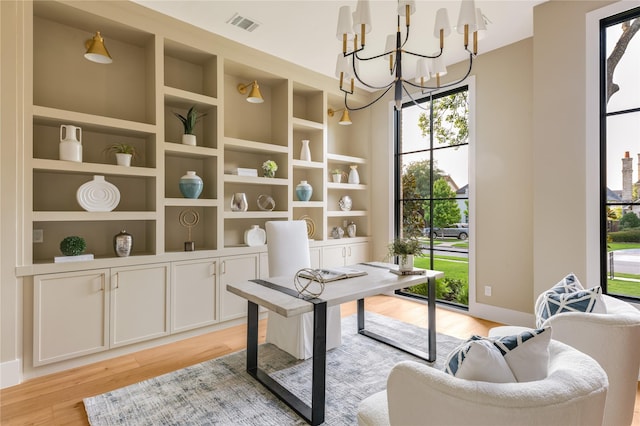 7226 Colgate Ave, Dallas, TX 75225 - office space featuring light wood finished floors and a chandelier
