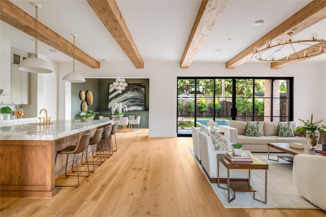 7226 Colgate Ave, Dallas, TX 75225 - living room with light wood finished floors and beam ceiling