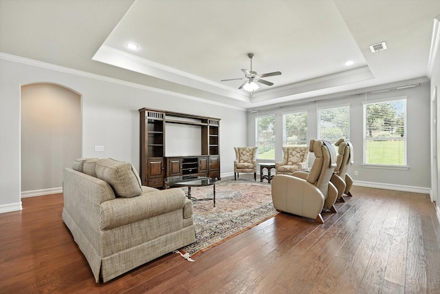 6460 Cherry Hills Dr, Frisco, TX 75036 - living area featuring a raised ceiling, ceiling fan, crown molding, hardwood / wood-style floors, and arched walkways