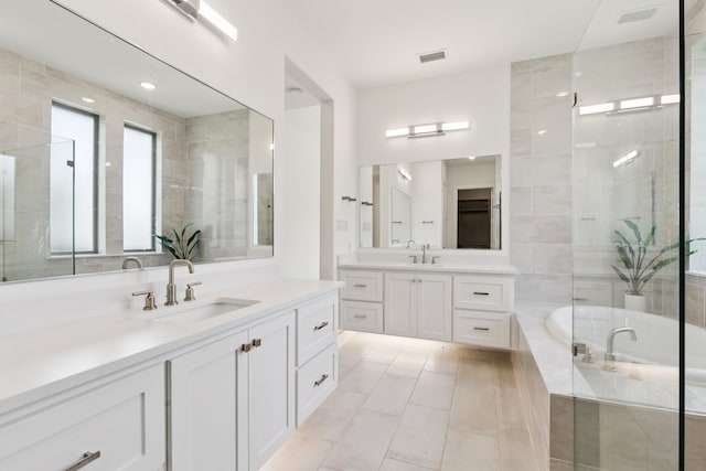 4541 Walnut Grove Ln, Prosper, TX 75078 - bathroom featuring two vanities, a bath, tile patterned flooring, and a tile shower