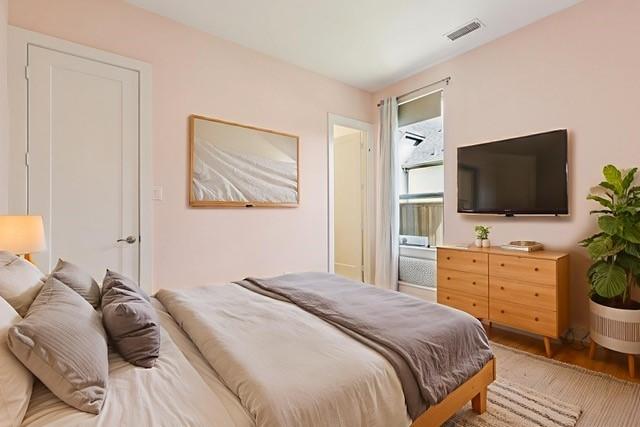 4541 Walnut Grove Ln, Prosper, TX 75078 - bedroom with light wood-style flooring