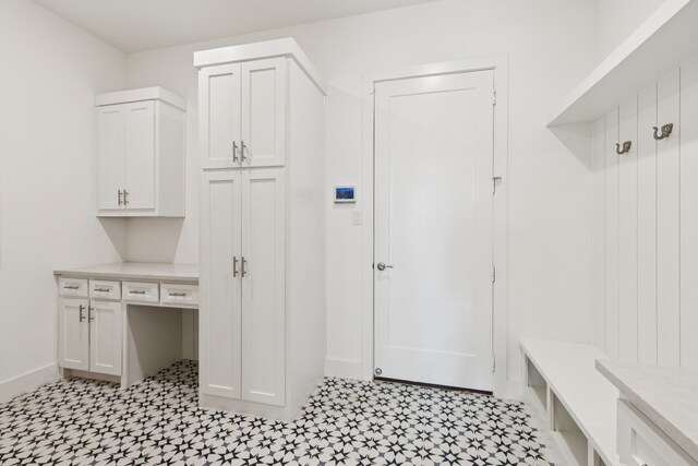 4541 Walnut Grove Ln, Prosper, TX 75078 - mudroom featuring light flooring and baseboards