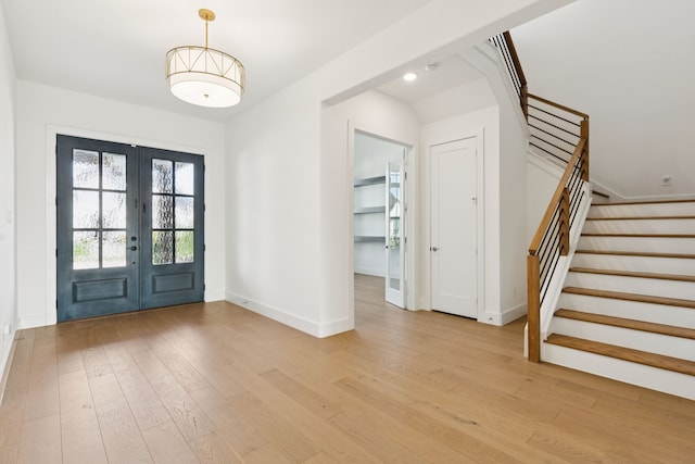 4541 Walnut Grove Ln, Prosper, TX 75078 - entrance foyer with french doors, stairs, and light wood-type flooring