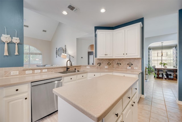 2621 Princeton Dr, Flower Mound, TX 75022 - kitchen with dishwasher, arched walkways, healthy amount of natural light, lofted ceiling, and recessed lighting