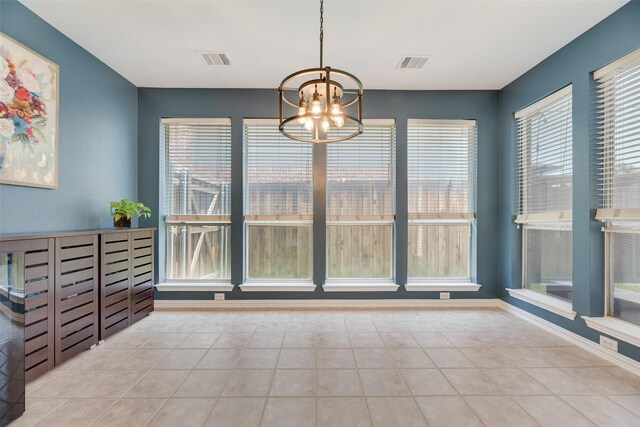 2621 Princeton Dr, Flower Mound, TX 75022 - unfurnished dining area featuring a chandelier and tile patterned floors